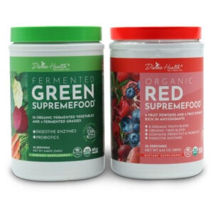 Two Divine Health superfood powder containers by Dr. Don Colbert, MD displayed side by side on a white background, featuring Fermented Green Supremefood with organic fermented vegetables and grasses, and Organic Red Supremefood made from organic fruit blends, both formulated with probiotics and digestive enzymes.