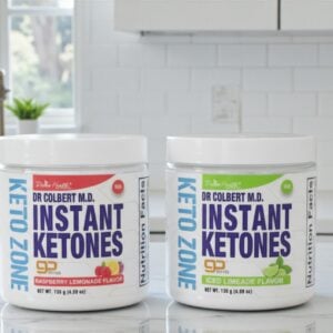 Dr. Colbert Keto Zone Instant Ketones goBHB powder in Raspberry Lemonade and Iced Limeade flavors on kitchen counter