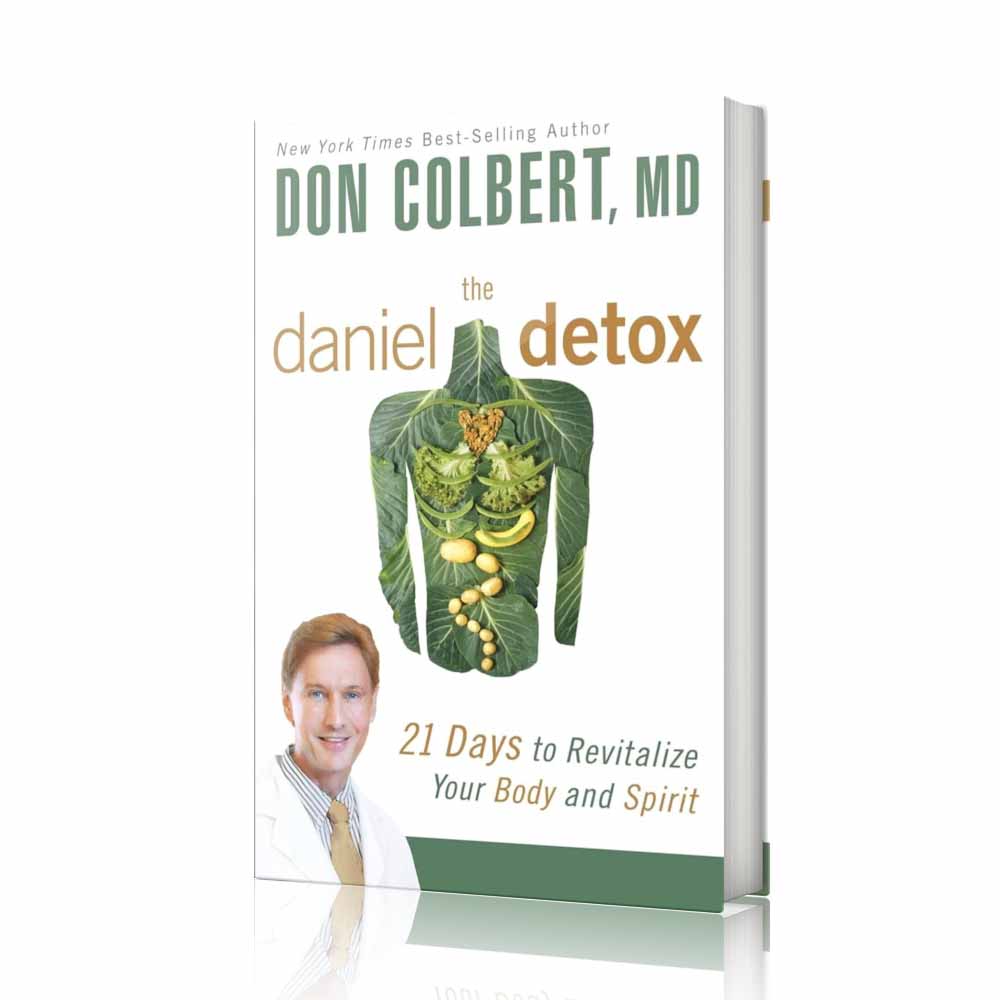 Softcover book The Daniel Detox: 21 Days to Revitalize Your Body and Spirit by Dr. Don Colbert, MD from Divine Health. The cover features a body silhouette made of leafy vegetables symbolizing detox nutrition and gut health. This health guide emphasizes whole foods, probiotics, fiber-rich nutrition, metabolic support, and healthy lifestyle strategies designed to help cleanse the body, improve digestion, and promote long-term wellness.