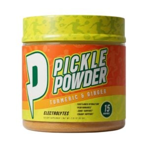 Pickle Powder Turmeric & Ginger electrolyte supplement container displayed on a white background, featuring a bright orange and lime-green label with a large stylized “P,” bold Pickle Powder branding, turmeric and ginger flavor text, 15-serving badge, and illustrated sports silhouettes across the lid and background, emphasizing the energetic, athletic-inspired packaging design.