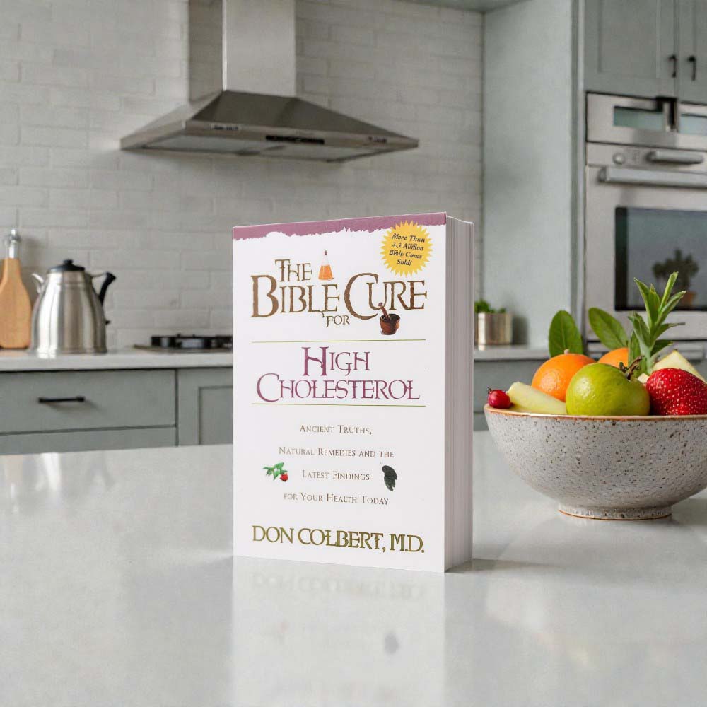 The Bible Cure for High Cholesterol book by Dr. Don Colbert, MD from Divine Health displayed on a white background, representing a natural health guide focused on supporting heart health and healthy cholesterol balance. The book discusses how nutrition, gut health, and lifestyle habits may influence cardiovascular wellness, including the importance of probiotics, fiber-rich foods, and balanced dietary strategies that support digestive health, metabolic function, and overall long-term wellness.