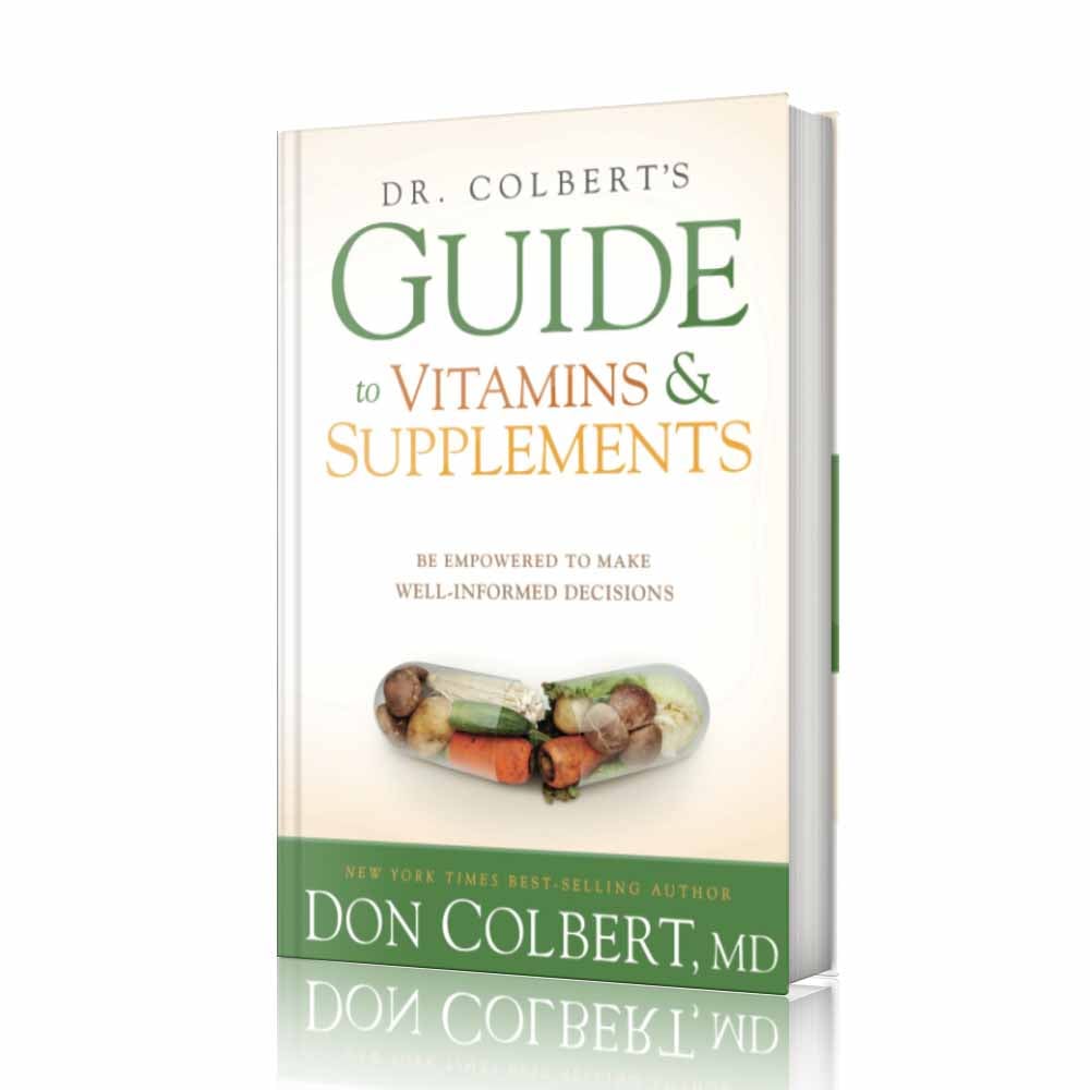 Hardcover book Dr. Colbert’s Guide to Vitamins and Supplements: Be Empowered to Make Well-Informed Decisions by Dr. Don Colbert, MD from Divine Health featuring a clean white cover with a capsule illustration filled with vegetables. This educational health book explains how vitamins, probiotics, and nutritional supplements can support gut health, immune function, and overall wellness. The guide discusses digestive balance through fiber supplements, microbiome support through probiotics, and wellness strategies that may incorporate collagen powder and MCT oil powder to help improve metabolism, nutrient absorption, and long-term health through the Divine Health lifestyle approach.