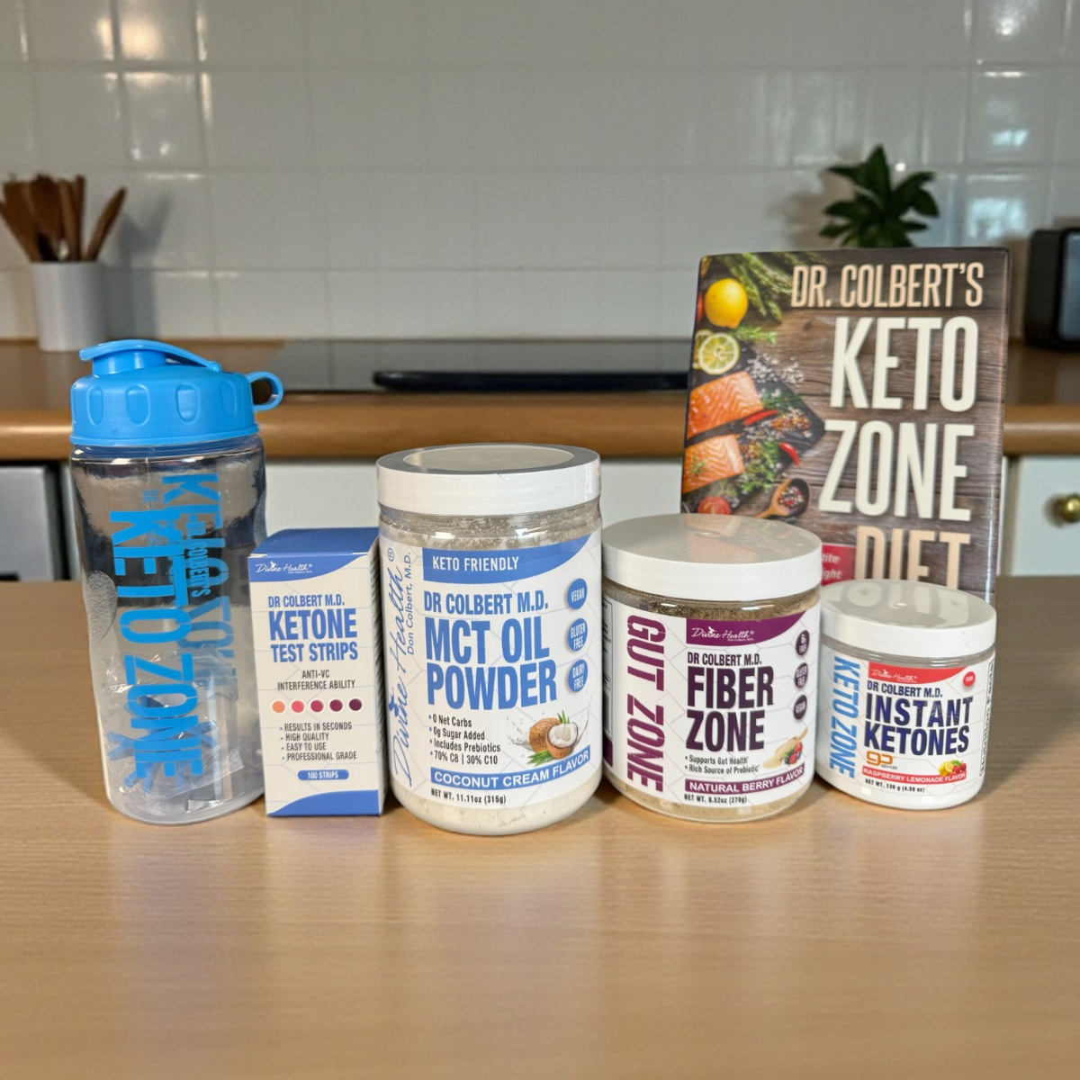 Keto Zone Starter Pack with MCT Oil Powder, Instant Ketones, Fiber Zone, test strips, shaker bottle, and Keto Zone Diet book.