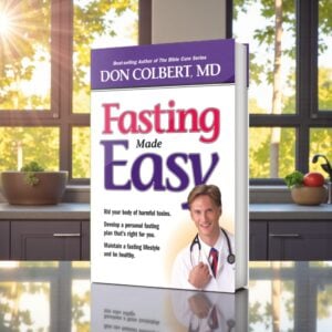 Fasting Made Easy wellness book by Dr. Don Colbert, MD displayed in a bright kitchen setting focused on fasting, nutrition, and healthy living