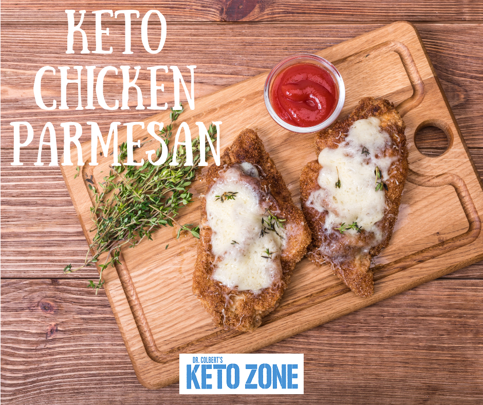 Keto chicken parmesan with almond flour crust, melted mozzarella and marinara in a baking dish