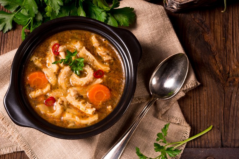 Bowl of creamy keto Tuscan soup with greens and cream broth