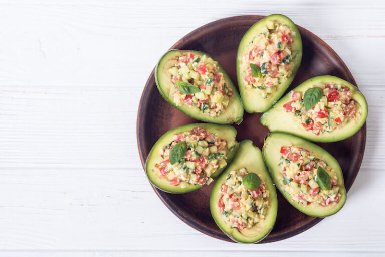 Avocado halves filled with seasoned taco meat and toppings