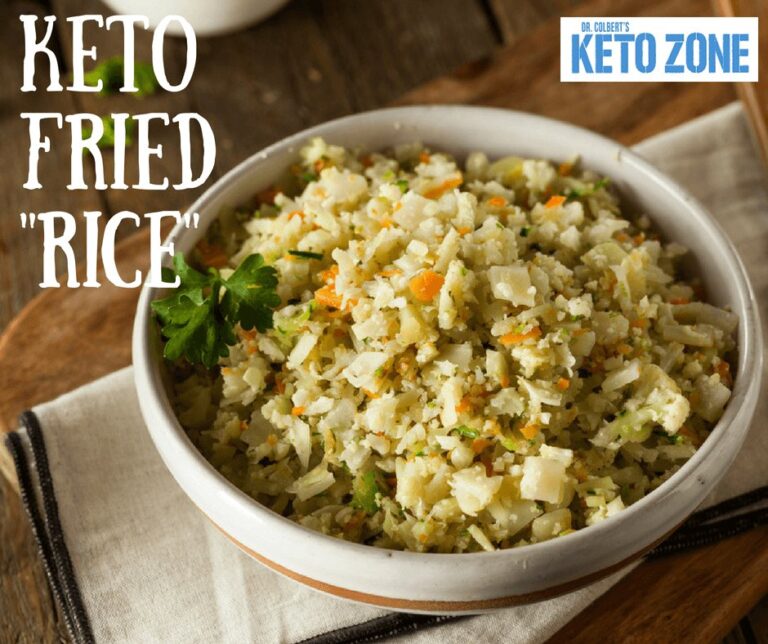 Keto cauliflower fried rice with egg, carrot and green onion in a skillet
