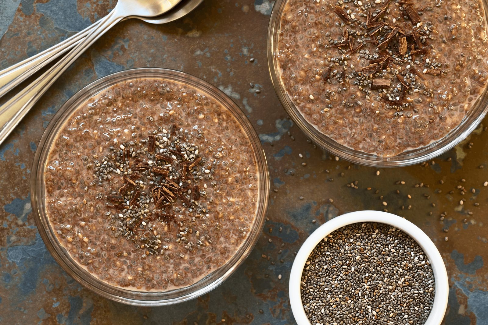 Keto chocolate chia pudding in glass jars topped with almonds and cacao nibs, a probiotic low carb breakfast