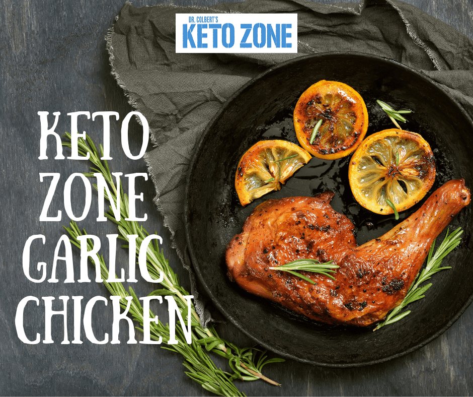 Roasted keto garlic rosemary chicken legs on a baking tray with lemon and fresh rosemary