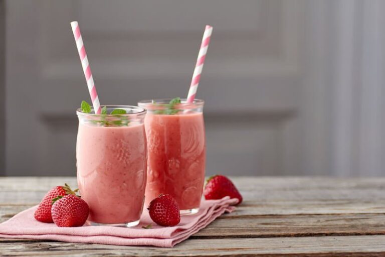 A keto strawberry avocado shake in a glass, a thick low carb smoothie