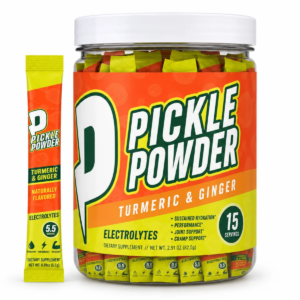Divine Health Pickle Powder Turmeric & Ginger electrolyte supplement canister with 15 individual stick packs and one stick displayed beside it